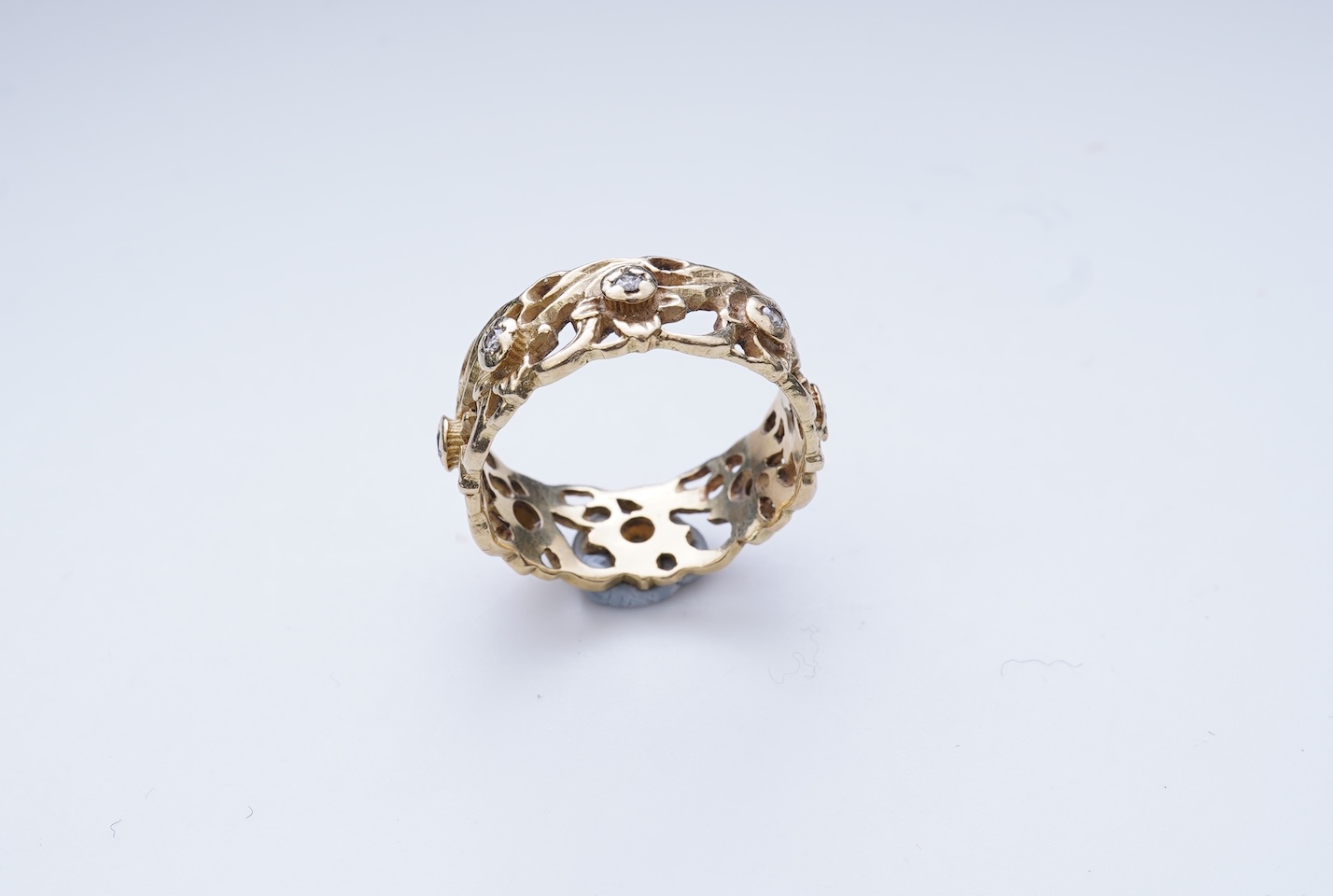 A gold and diamond eternity ring